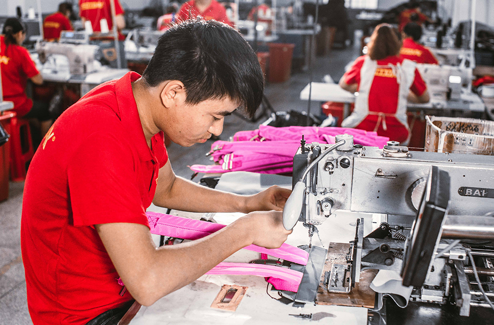 Close-up of automated high-speed precision sewing machines in action